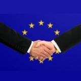 european-union-flag-and-business-handshake